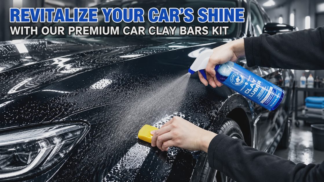 Hand spraying clay lubricant on a black car while wiping the panel with a yellow clay bar